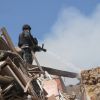 Russian bombs hit school in Ukraine's Kherson as drones target rescuers during response