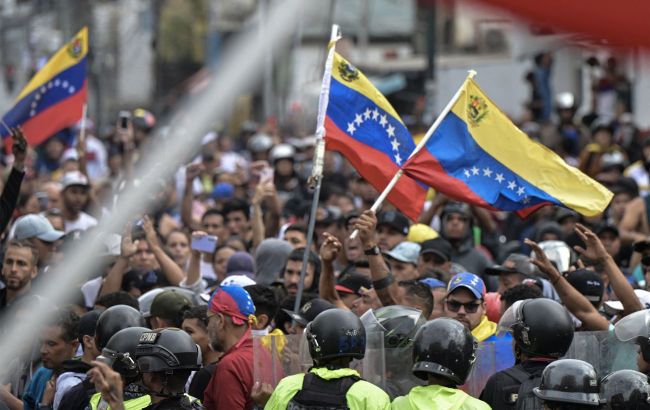 Gas, gunfire, and water cannons: Protests against Maduro erupt in Venezuela