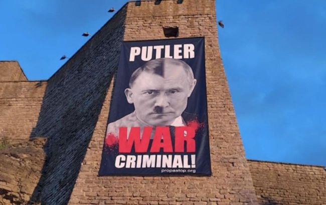 'Putler - war criminal': Estonian museum displays poster on border with Russia