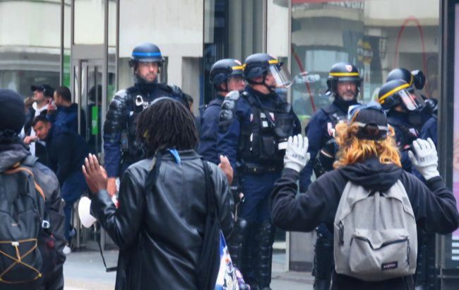 Half a million take to the streets in France as riots erupt in cities
