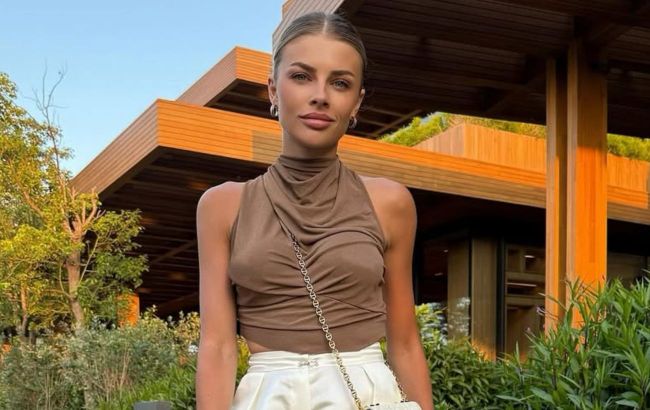Fashion inspo: Ukrainian footballer's wife pairs lace shorts with over-the-knee boots