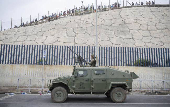 Spain plans new border barrier after 60,000 migrants surge into Ceuta