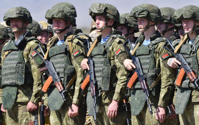 Russian-marked armored vehicles flood Belarus streets, signaling possible military buildup