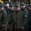 Russian officials admit to raids on men, threaten action over published videos