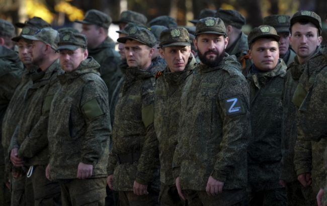 Russian officials admit to raids on men, threaten action over published videos