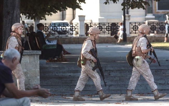 Russian troops take off aircraft from Saky airfield as explosions reported in Crimea