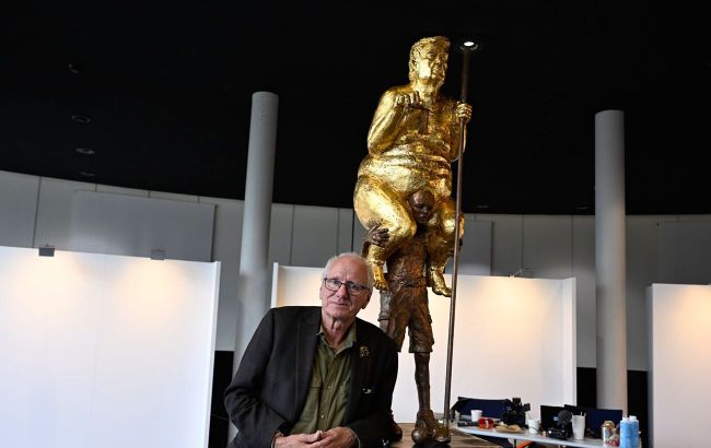 Gold-plated and holding golf club: Trump statue installed in European Parliament
