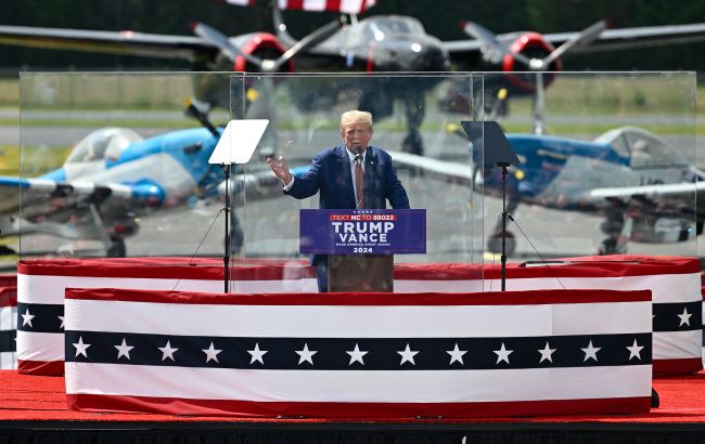 Trump holds first rally after assassination attempt behind bulletproof glass