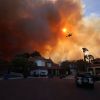 Wildfire rages in elite Los Angeles neighborhood: 30,000 forced to evacuate