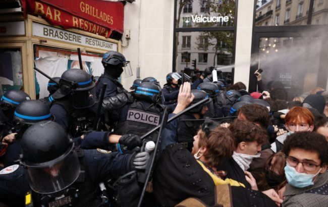 Buses set on fire, barricades erected as student protests spread across Europe