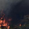 Massive wildfire in Greece reaches Athens suburbs, thousands evacuated