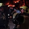 Russian attack on Kyiv sets homes, warehouses and office building ablaze