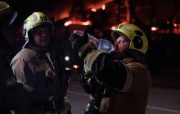 Russian attack on Kyiv sets homes, warehouses and office building ablaze