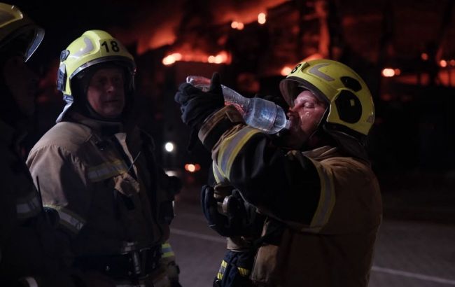 Russian attack on Kyiv sets homes, warehouses and office building ablaze